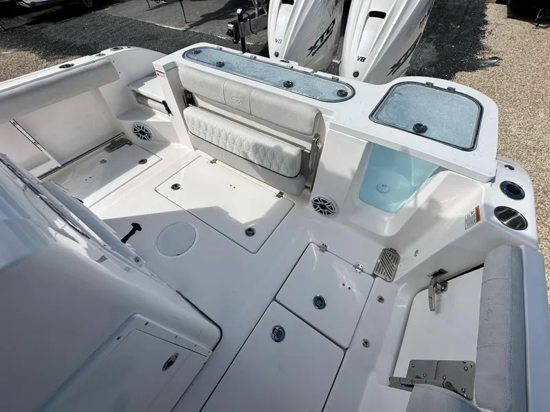 Slide: The Image of 2024 Sea Fox 328 Commander boat deck with seating and storage compartments. - 20