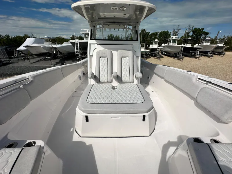 Slide: The Image of 2024 Sea Fox 328 Commander boat interior with seating and console. - 24