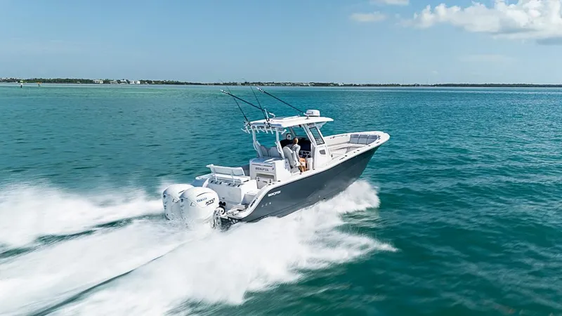 Slide: The Image of 2024 Sea Fox 328 Commander cruising on open water, showcasing powerful dual engines. - 6