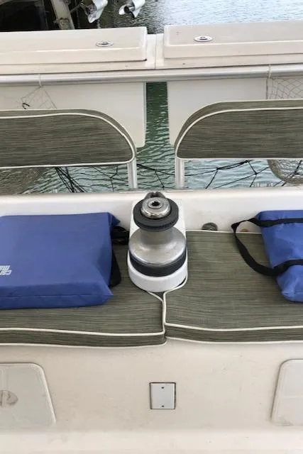 Slide: The Image of Boat seating area on a 2005 Manta 42 MK II with cushions and winch. - 6