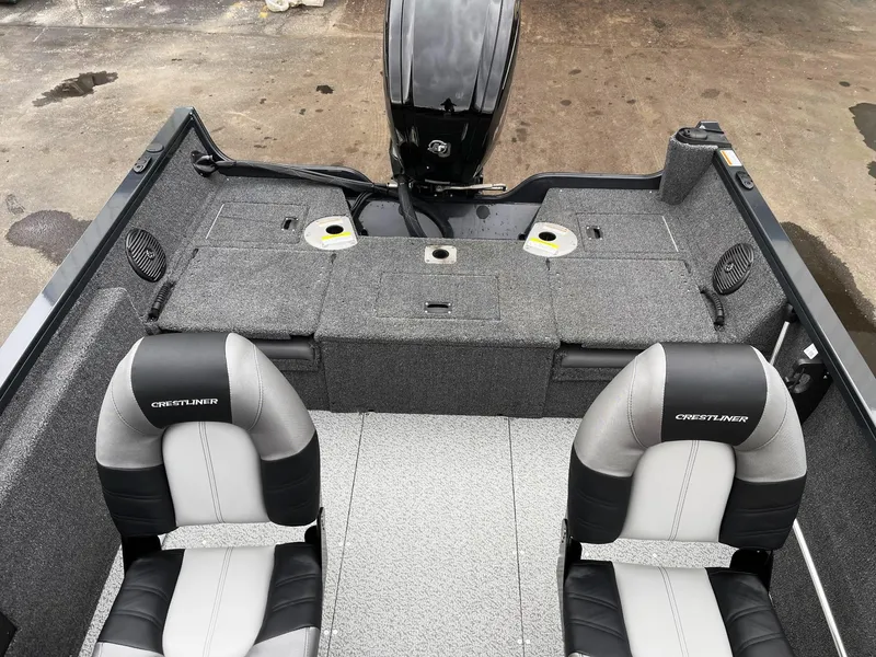 Slide: The Image of 2023 Crestliner 1650 Fish Hawk boat interior with two seats and motor. - 3