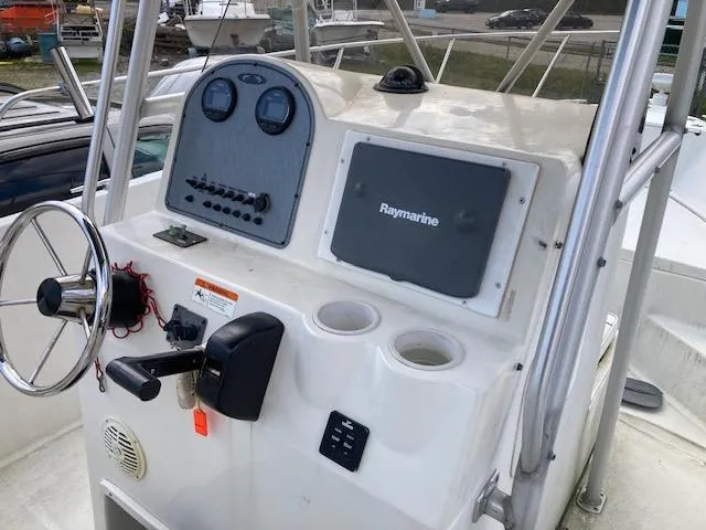 Slide: The Image of 2007 Hydra-Sports 2400 boat console with steering wheel and Raymarine navigation system. - 10