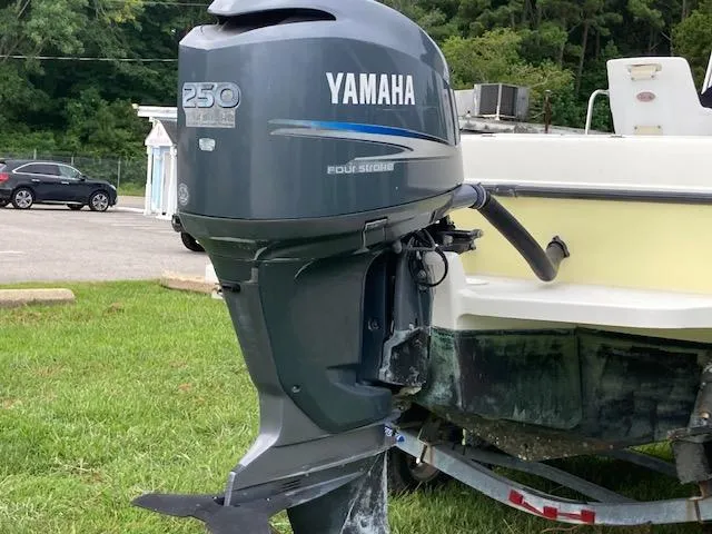 Slide: The Image of Yamaha 250 outboard motor on 2007 Hydra-Sports 2300 boat, parked on grass. - 12
