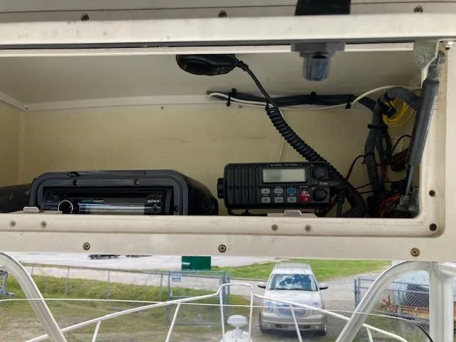 Slide: The Image of 2007 Hydra-Sports 2400 boat electronics compartment with radio and stereo system. - 9