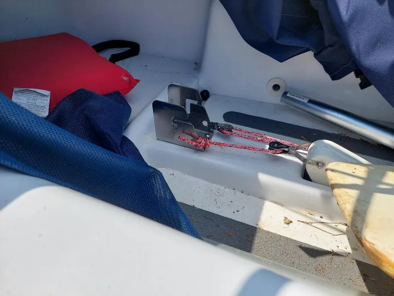 Slide: The Image of Interior of a 1998 Hunter 170 sailboat with ropes and equipment. - 10