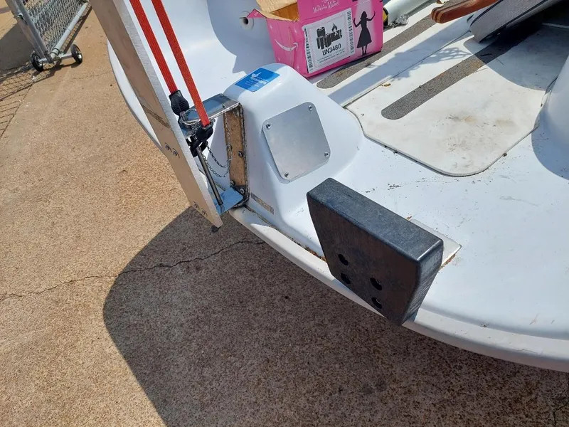Slide: The Image of Rear view of a 1998 Hunter 170 boat with visible hardware and accessories. - 11
