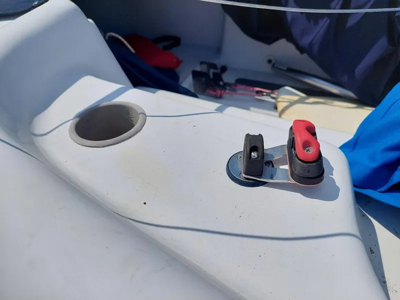 Slide: The Image of Cockpit of 1998 Hunter 170 sailboat with cleat and cup holder. - 9