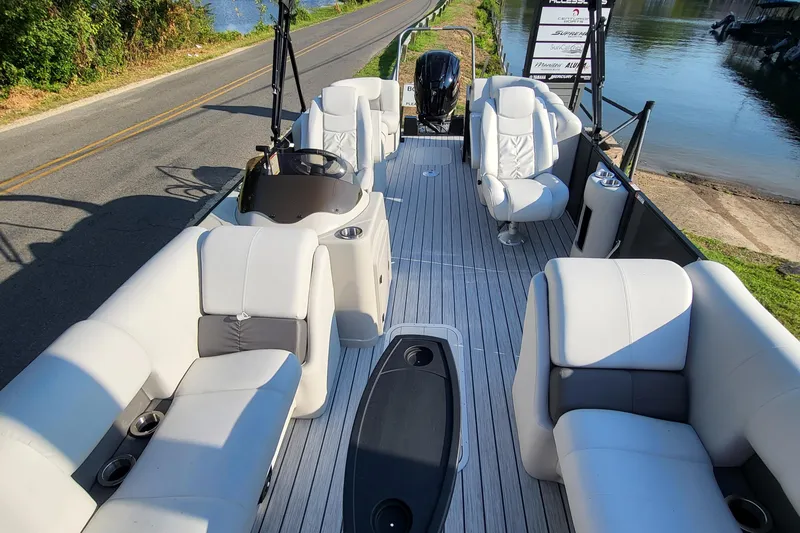 Slide: The Image of 2023 SunCatcher Fusion 322RC pontoon boat with spacious seating and modern design. - 12