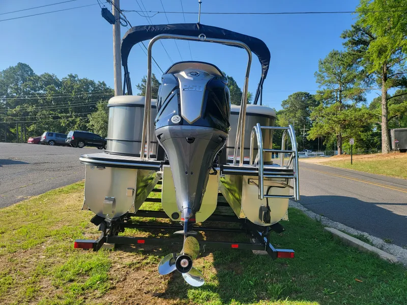 Slide: The Image of 2023 SunCatcher Fusion 322RC pontoon boat on trailer, rear view. - 3