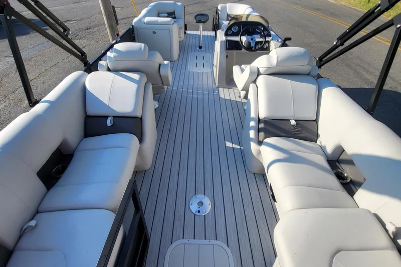 Slide: The Image of 2023 SunCatcher Fusion 322RC pontoon boat interior with spacious seating and modern design. - 4