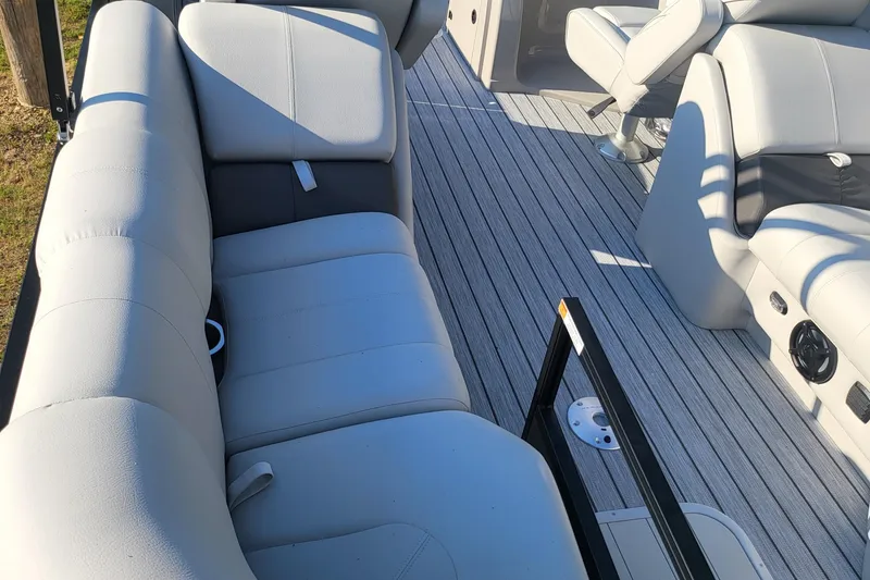 Slide: The Image of Interior seating of 2023 SunCatcher Fusion 322RC pontoon boat with gray upholstery. - 7