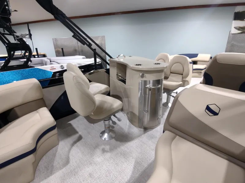 Slide: The Image of Interior of 2024 South Bay 523E 2.75 pontoon boat with beige seating and modern design. - 5