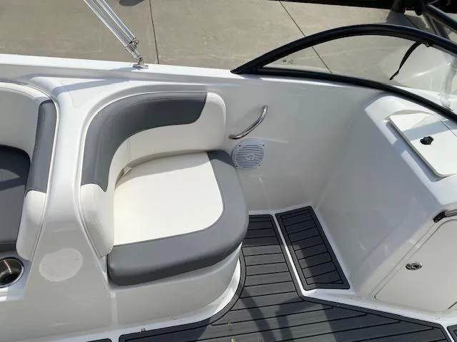 Slide: The Image of 2024 Bayliner Element E21 boat interior seating with gray and white upholstery. - 13