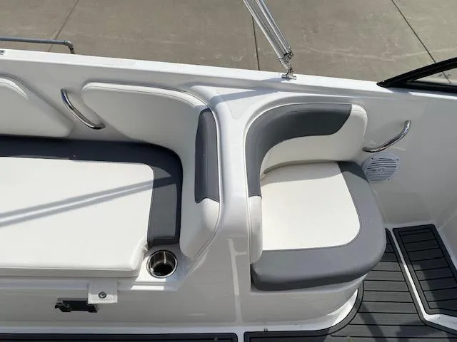 Slide: The Image of 2024 Bayliner Element E21 boat seating area with white and gray cushions. - 14