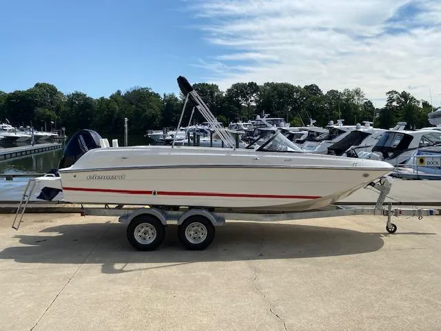 Slide: The Image of 2024 Bayliner Element E21 boat on a trailer at a marina. - 5