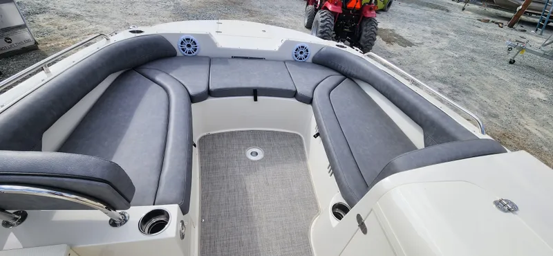 Slide: The Image of 2022 Stingray 212SC boat with spacious seating and modern design. - 10