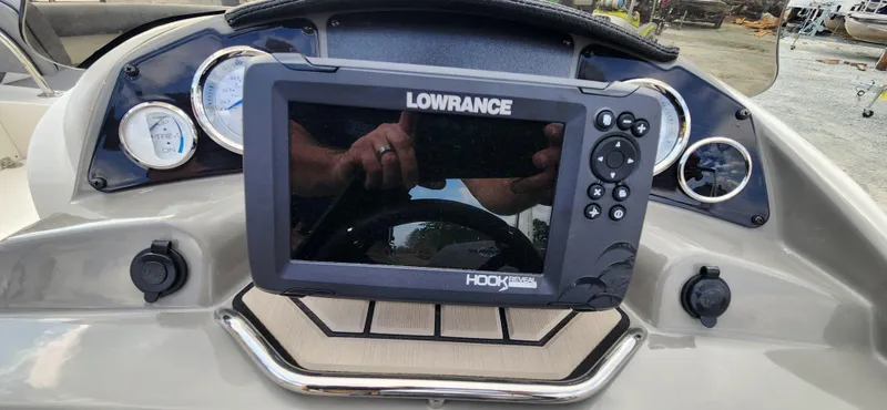 Slide: The Image of Lowrance Hook Reveal fish finder on 2022 Stingray 212SC boat dashboard. - 15