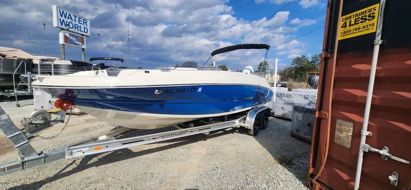 Slide: The Image of 2022 Stingray 212SC boat on trailer at Water World dealership. - 3