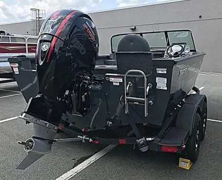 Slide: The Image of 2023 Ranger VS1882SC Angler boat with outboard motor in parking lot. - 6