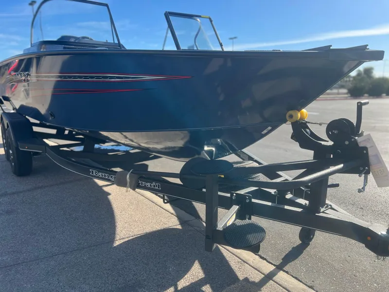 Slide: The Image of 2023 Ranger VX1788 WT boat on a trailer in sunlight. - 2