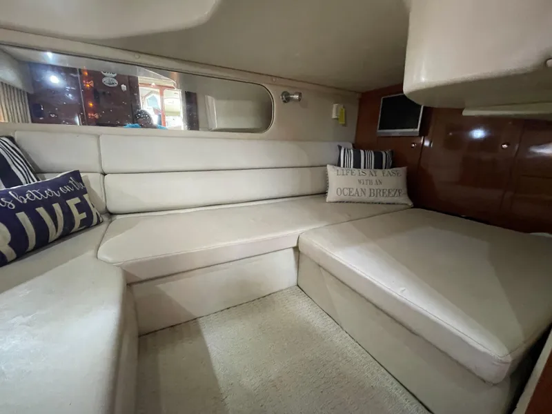 Slide: The Image of Interior of 2005 Regal Commodore 3560 IB with beige seating and decorative pillows. - 22