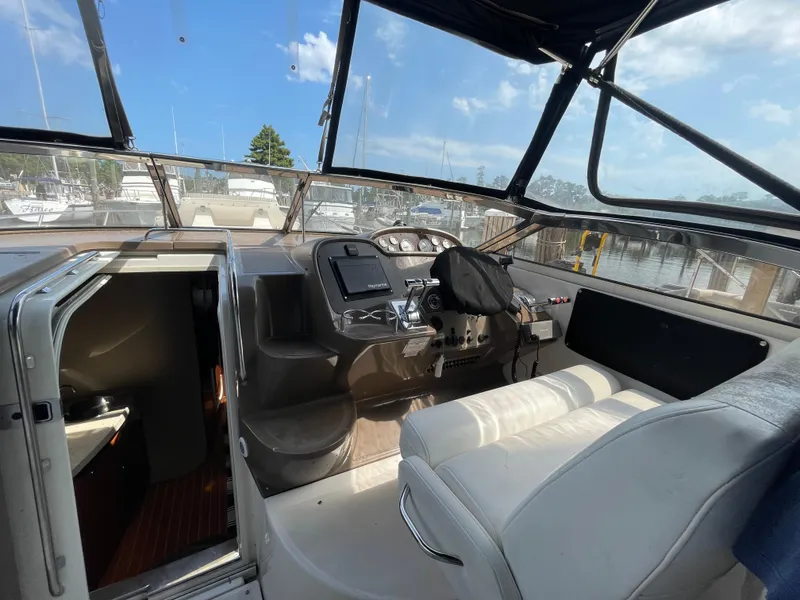 Slide: The Image of Interior cockpit of 2005 Regal Commodore 3560 IB yacht at marina. - 3