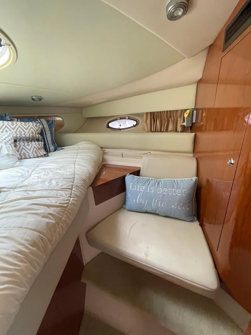 Slide: The Image of Interior cabin of 2005 Regal Commodore 3560 IB with cozy seating and nautical decor. - 33