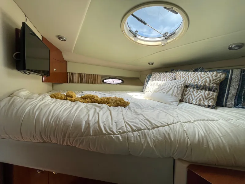 Slide: The Image of Luxurious bedroom in 2005 Regal Commodore 3560 IB yacht with skylight and TV. - 34