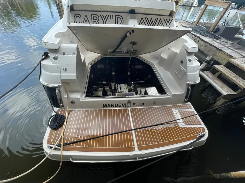 Slide: The Image of 2005 Regal Commodore 3560 IB boat docked with open engine compartment. - 38