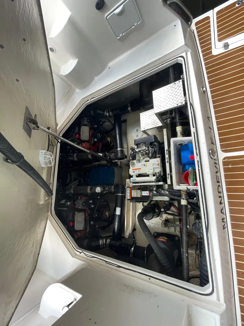 Slide: The Image of Engine compartment of a 2005 Regal Commodore 3560 IB boat. - 43