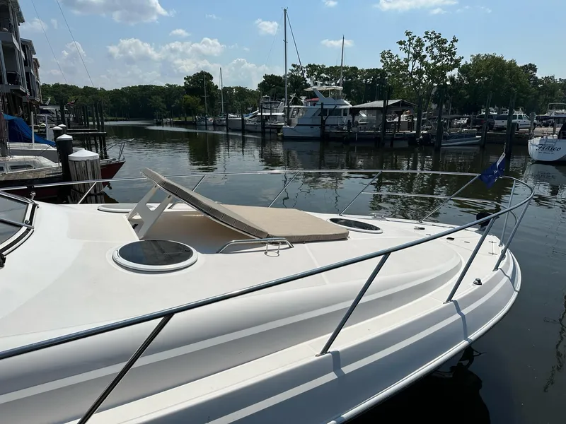 Slide: The Image of 2005 Regal Commodore 3560 IB yacht docked at a marina on a sunny day. - 44