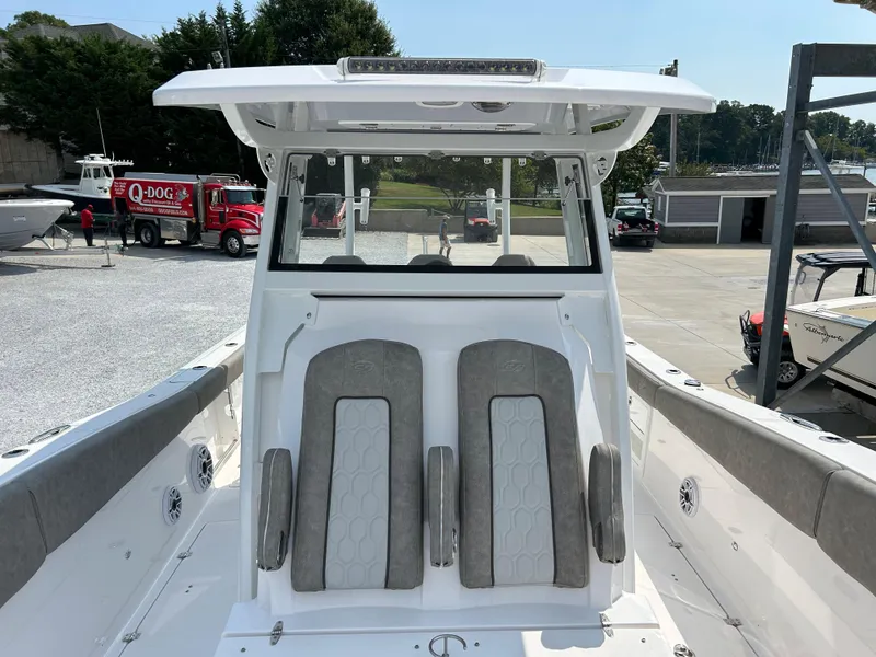 Slide: The Image of 2024 Sea Fox 328 Commander boat with dual seats and sleek design. - 13