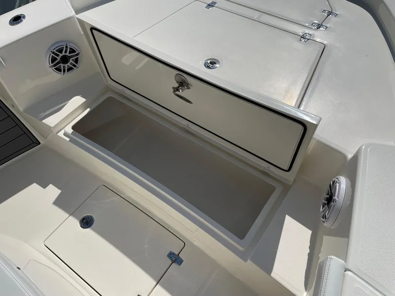 Slide: The Image of 2024 Pathfinder 2400 Open boat storage compartments and speakers. - 11