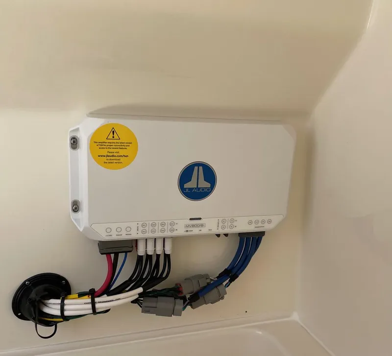 Slide: The Image of JL Audio system in 2024 Pathfinder 2400 Open boat, featuring connected wiring. - 17