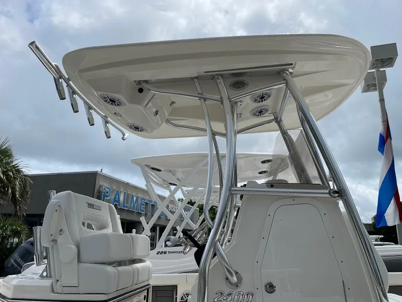 Slide: The Image of 2024 Pathfinder 2400 Open boat with T-top and rod holders. - 3