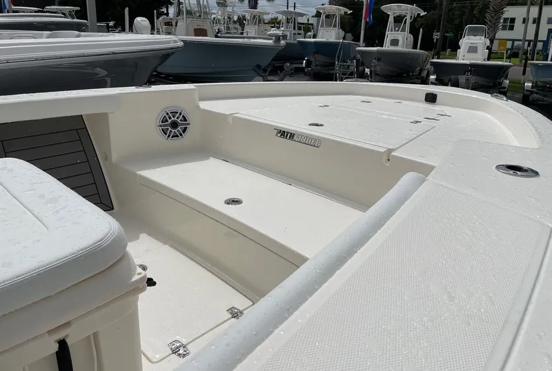 Slide: The Image of 2024 Pathfinder 2400 Open boat interior with seating and storage compartments. - 7