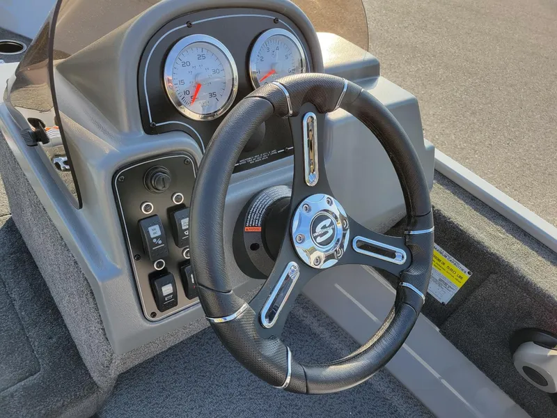 Slide: The Image of 2025 Smoker Craft 151 Resorter side console with Yamaha 25 hp, steering wheel and gauges. - 11