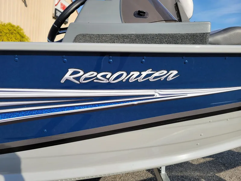 Slide: The Image of 2025 Smoker Craft 151 Resorter side console boat, blue exterior, in stock with Yamaha 25 hp. - 5