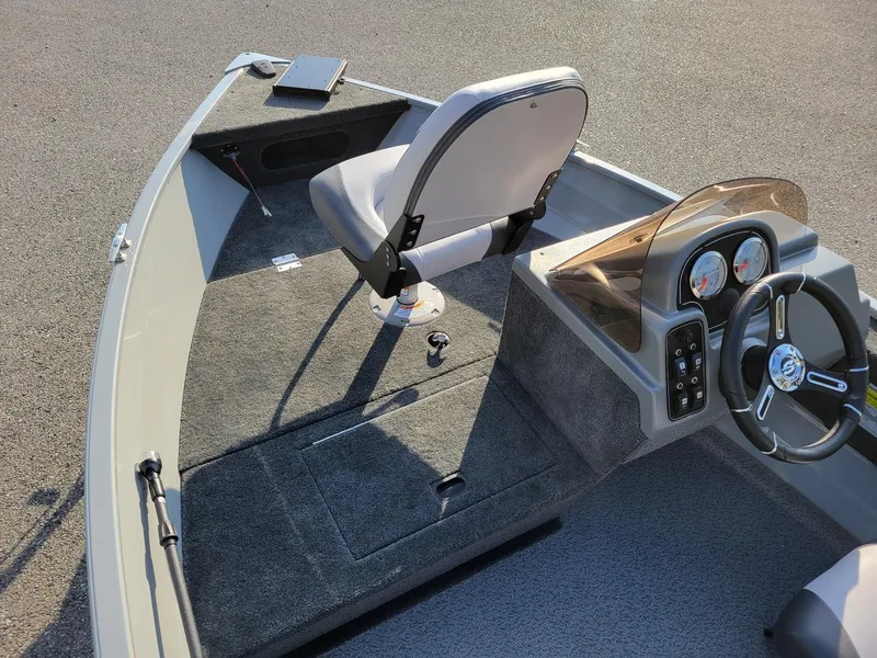 Slide: The Image of 2025 Smoker Craft 151 Resorter side console boat interior with Yamaha 25 hp engine. - 7