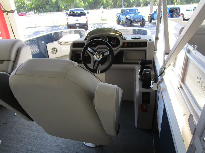 Slide: The Image of Captain's seat and helm of 2024 Sweetwater Xperience SW 2286 FX pontoon boat. - 4