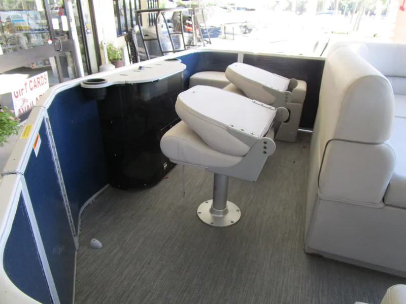Slide: The Image of Interior of 2024 Sweetwater Xperience SW 2286 FX pontoon boat with seating and console. - 6