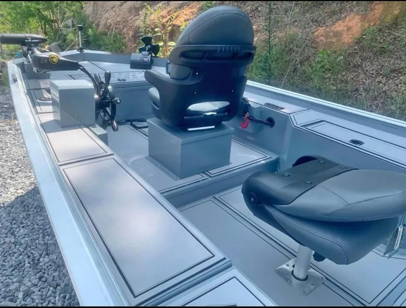 The Image of 2025 Custom 1860 Ultimate Panfish boat interior with seating and fishing equipment. - 0