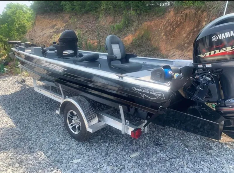 Slide: The Image of 2025 Custom 1860 Ultimate Panfish boat with Yamaha engine on a trailer. - 2