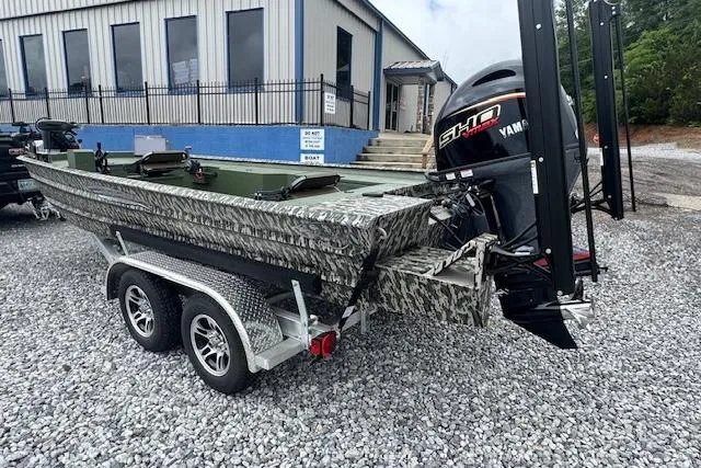 Slide: The Image of 2026 Custom 1860 Ultimate Panfish boat on trailer with Yamaha motor, parked on gravel. - 9