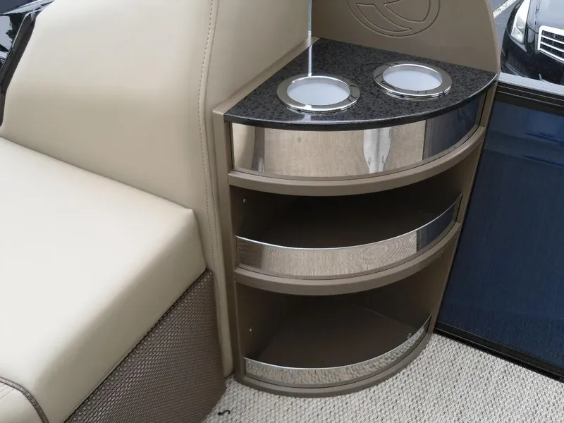 Slide: The Image of 2024 Regency 250 DL3 boat interior with cup holders and storage shelves. - 15