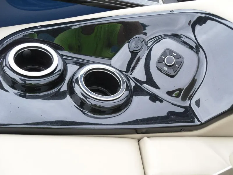 Slide: The Image of Control panel and cup holders on 2024 Regency 250 DL3 boat. - 21