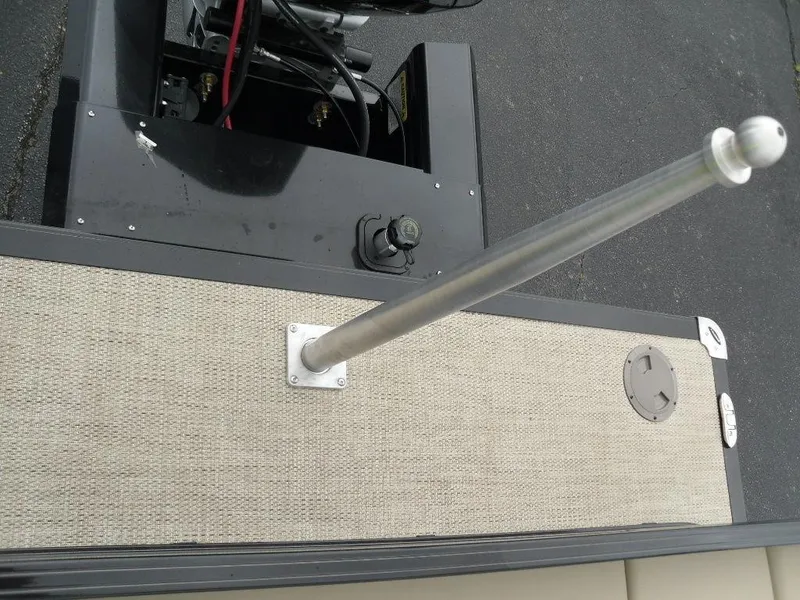 Slide: The Image of 2024 Regency 250 DL3 boat deck with pole and engine components. - 22