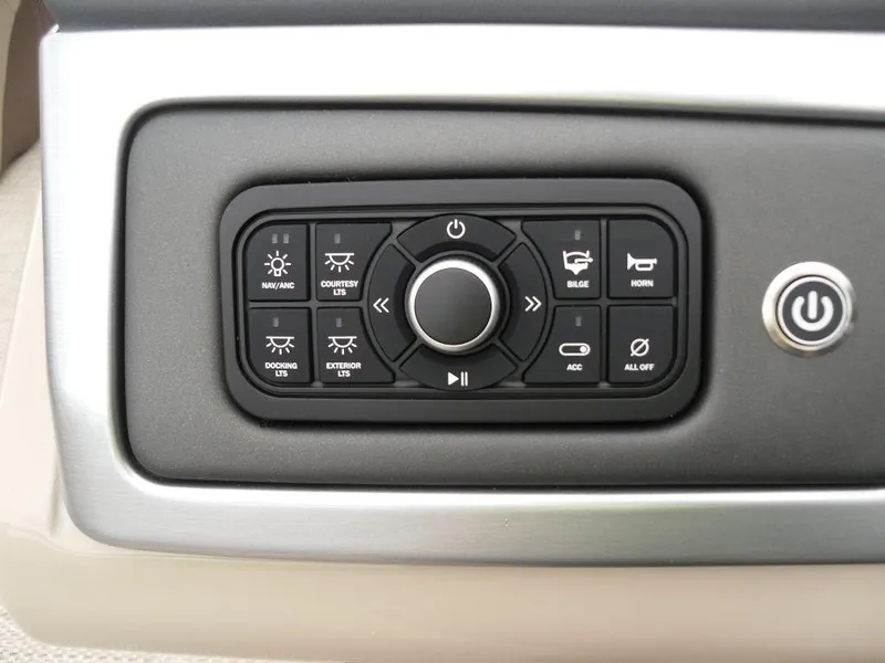 Slide: The Image of 2024 Regency 250 DL3 control panel with various function buttons and power switch. - 31