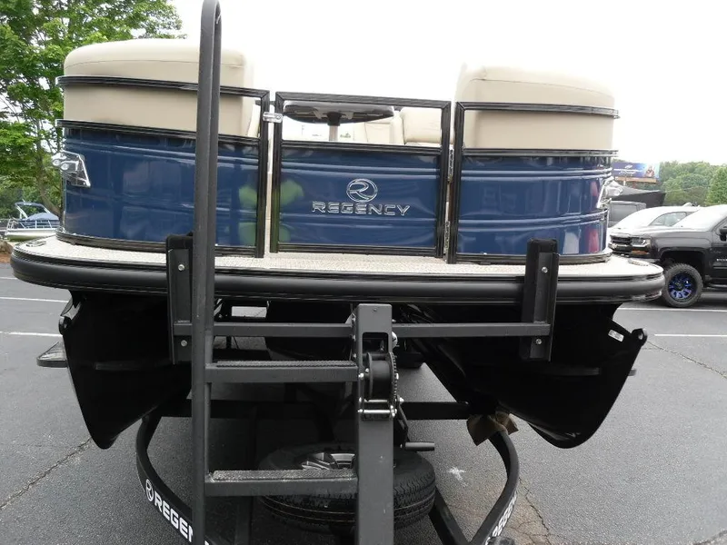 Slide: The Image of 2024 Regency 250 DL3 pontoon boat on trailer, rear view. - 9