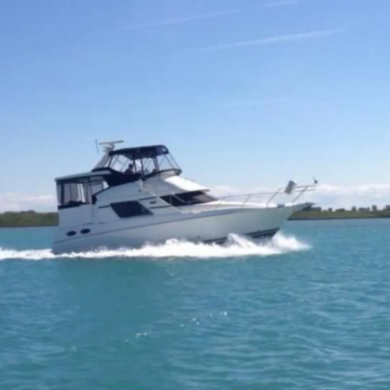 The Image of 2000 Silverton 392 Motor Yacht cruising on open water. - 0